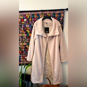 Cream colored, fuzzy jacket, size small, shawl neck